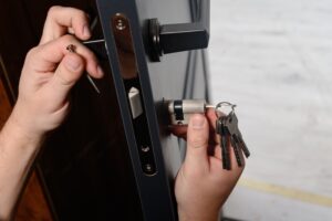 Locksmith installing the core of a door lock in Vancouver, BC