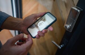 Man opening his house door using a home automation system in Vancouver, BC